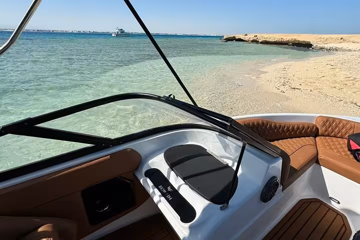 Speedboat cockpit by Orange Island beach, Hurghada, with crystal-clear lagoon on private snorkeling tour