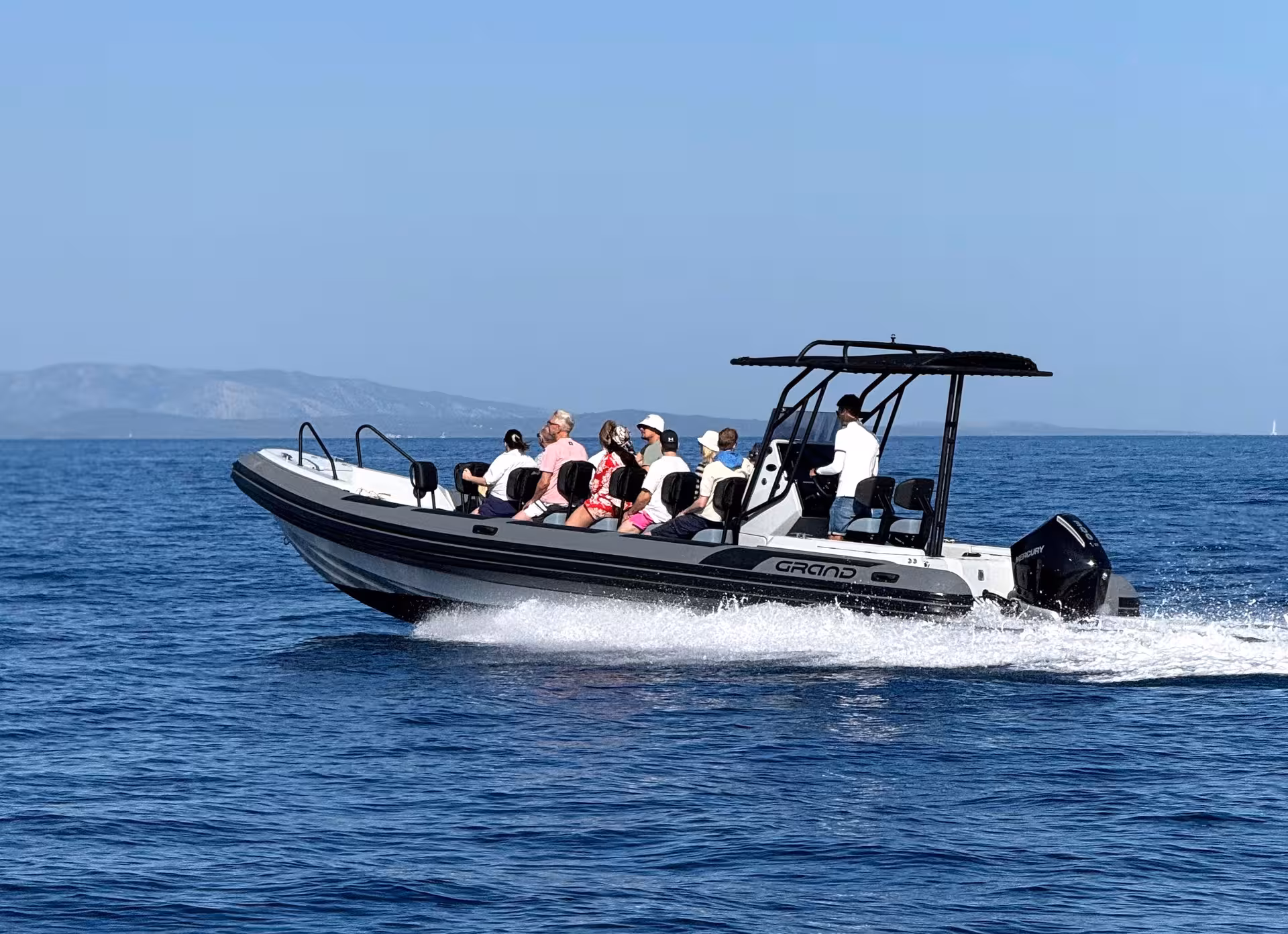 Speedboat cruising between Croatian islands on 3 Islands tour, heading to Blue Lagoon and hidden cave stops