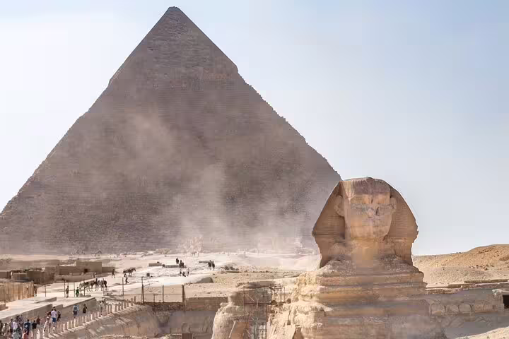 Sphinx with Great Pyramid of Khafre in background at Giza, scenic stop on private pyramids and museum tour