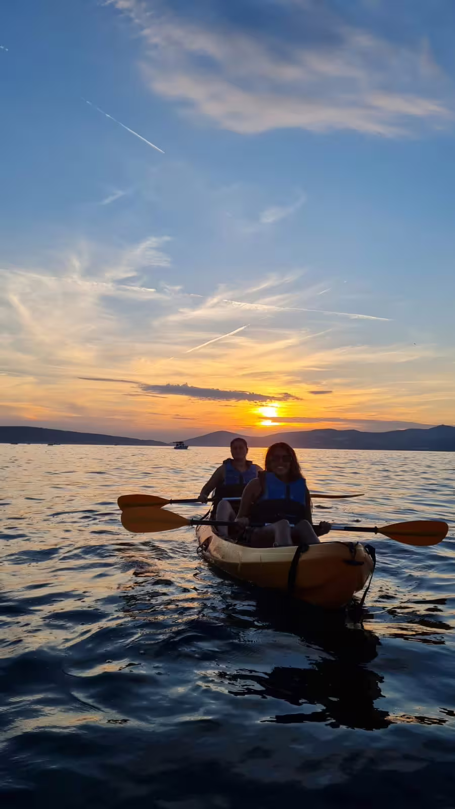 Tandem sea kayak on Adriatic at golden hour in Split, Croatia, sunset kayaking tour with wine included