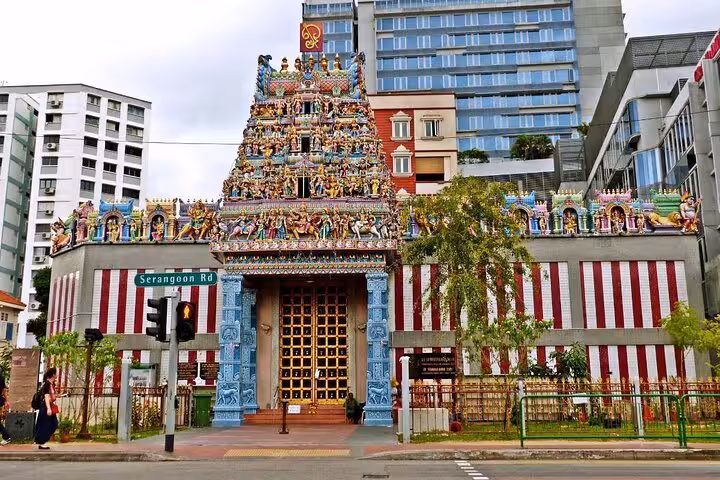 Sri Veeramakaliamman Temple in Little India, Singapore, showcasing its ornate gopuram against modern buildings.