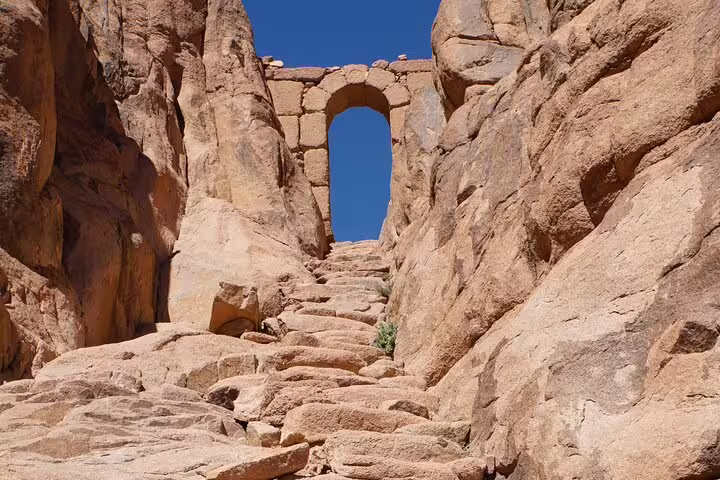 Stone steps leading to an ancient archway at St Catherine Monastery, Sinai, on overnight tour from Cairo