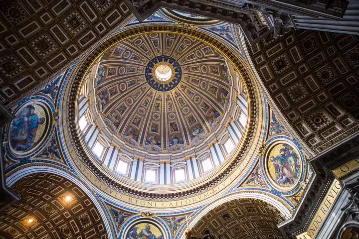 Interior view of St Peter’s Basilica dome with ornate Renaissance frescoes on Vatican Museum and Sistine Chapel tour