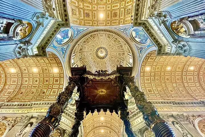 Ornate golden ceiling and Bernini baldachin inside St Peter’s Basilica, Rome, on guided dome and Castel Sant’Angelo tour
