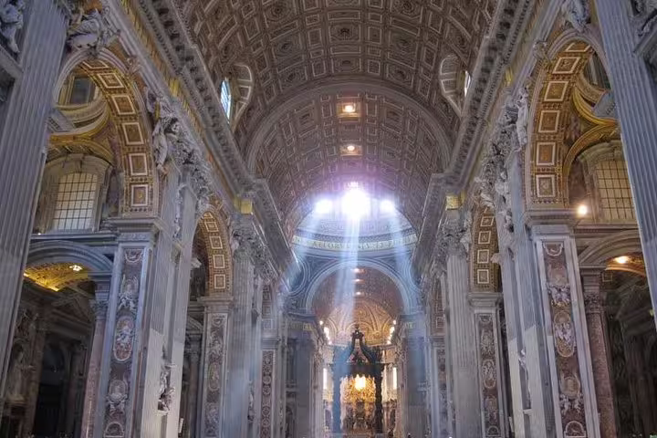 Sunlight streams through the nave of St Peter’s Basilica on a private Vatican Museums and Sistine Chapel VIP tour in Rome