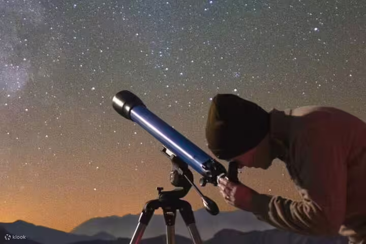 Astronomy stargazing in Sinai desert from Sharm El Sheikh with telescope under clear Milky Way sky