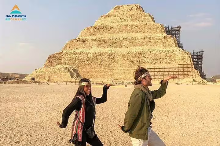 Tourists posing at the Step Pyramid of Djoser in Saqqara on a 2-day Alexandria to Cairo and Giza tour