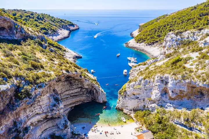 Stiniva Cove on Vis Island with turquoise water, a highlight stop on Blue Cave, Hvar and Pakleni tour