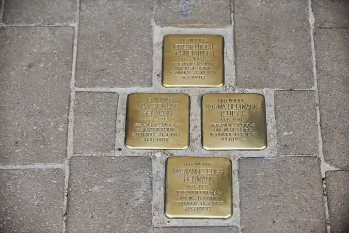 Stolpersteine memorial plaques in Amsterdam pavement, a poignant stop on a self-guided GPS audio tour