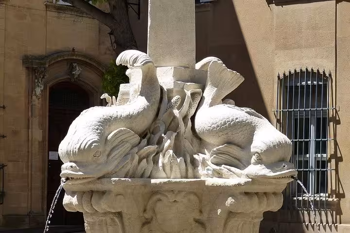 Stone fish fountain in Aix-en-Provence, heritage detail seen on Cézanne and the winegrowers wine tour walk
