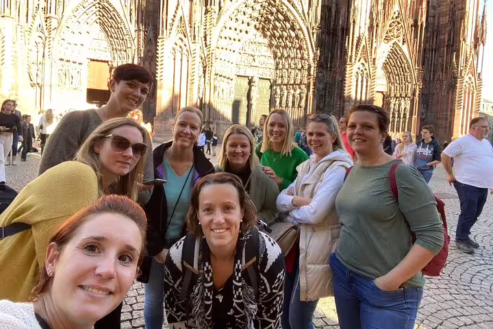 Group photo at Strasbourg Cathedral during scavenger hunt city highlights walking tour in Grande Île