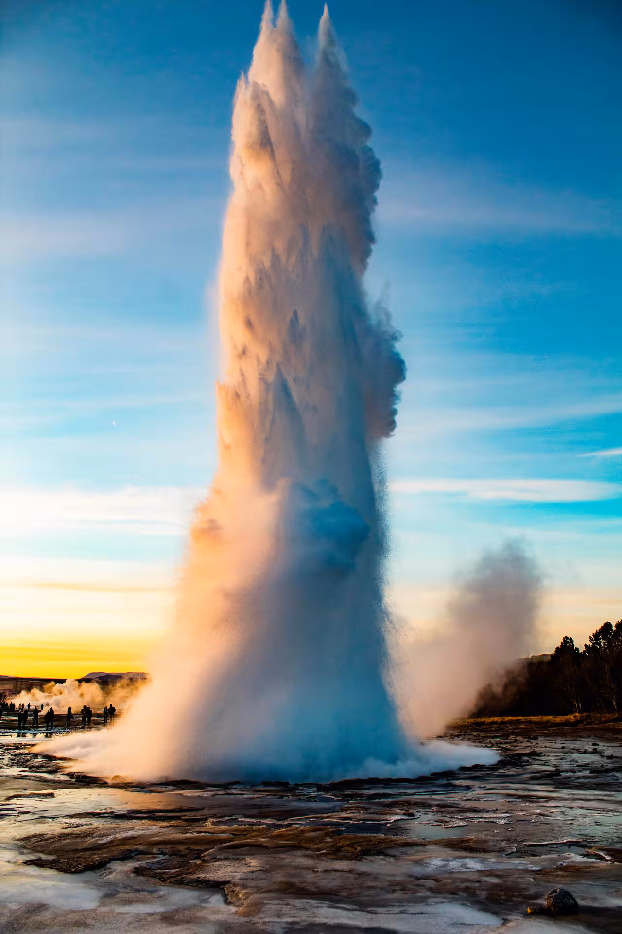 Strokkur geyser erupting at sunset in Geysir area on Iceland Golden Circle private tour for 1–6 passengers