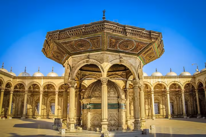 Ornate ablution fountain at Sultan Hassan Mosque courtyard, a highlight of Islamic Cairo day tour