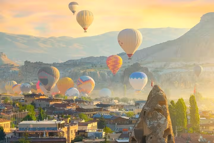 Sunrise hot air balloons over Göreme, Cappadocia on an all-inclusive private guided tour with balloon option