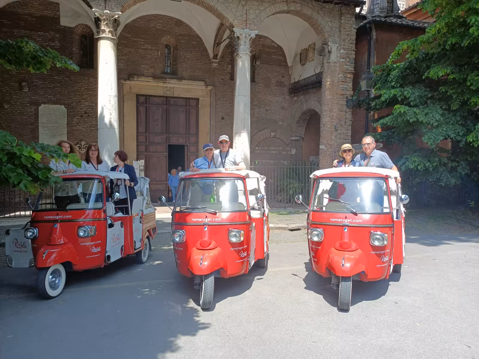 Tourists enjoy a unique tuk-tuk ride in Rome, perfect for the Sunset in Rome Combo Tour.