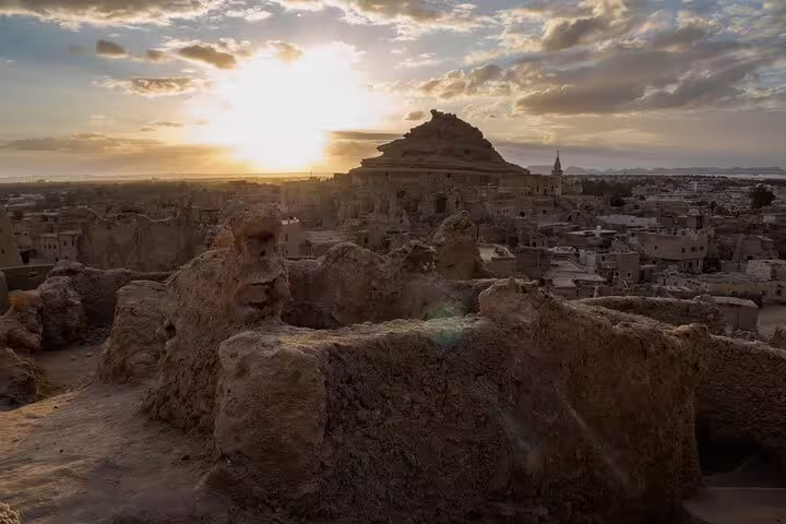 Sunset over Shali Fortress ruins in Siwa Oasis, Egypt, on a 3-day private Western Desert tour