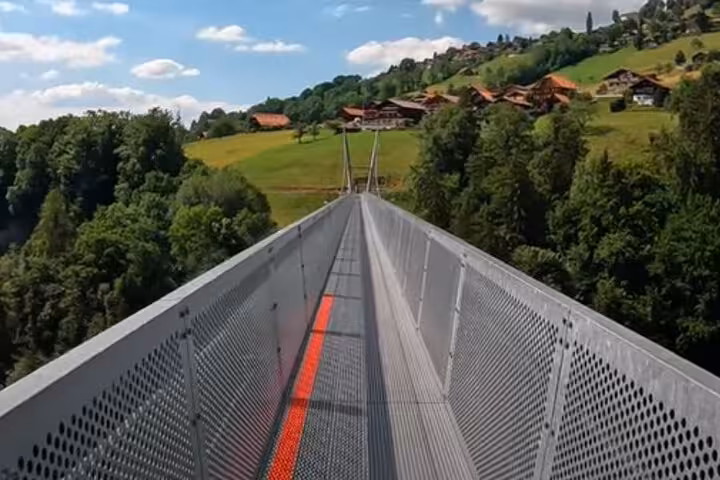 Suspension bridge leading to charming hillside village on Crash Landing on You private tour.