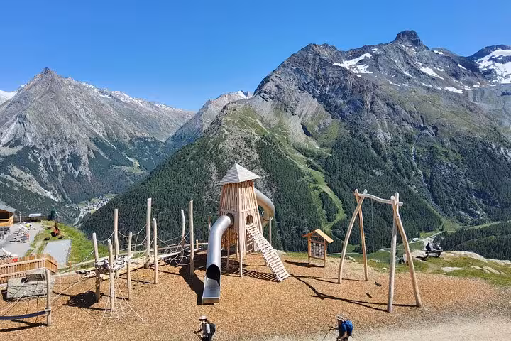 Alpine playground viewpoint above a Swiss valley, scenic stop on 4-day Swiss Magic Through the Alps trek