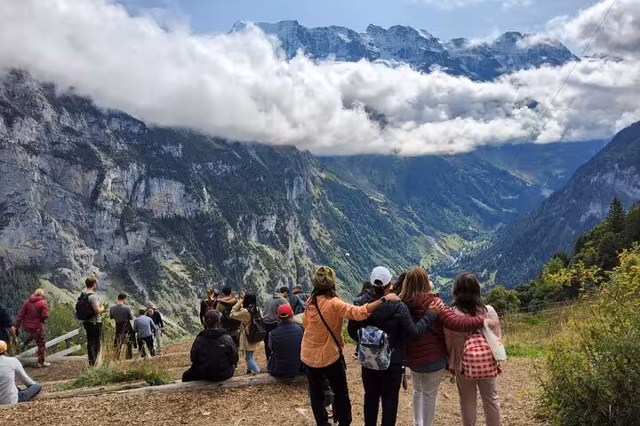 Swiss Alps group hike above Lauterbrunnen valley, Jungfrau Region viewpoint on 4-day Zermatt tour