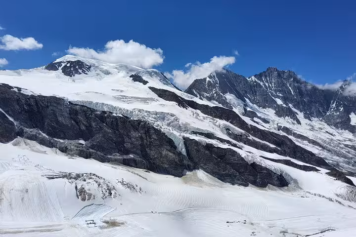 Snowy glacier and rugged peaks in the Swiss Alps near Jungfrau region, scenic stop on 4-day tour