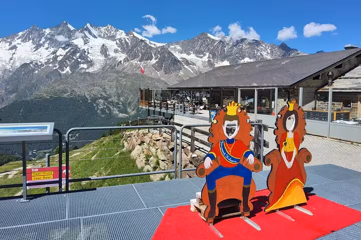 Alps viewpoint terrace near mountain station with snowy peaks, stop on Swiss Magic Through the Alps trek