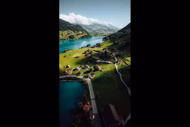 Breathtaking view of Swiss countryside and lake with Swiss Travel Pass Tours, featuring private guide and custom itinerary.