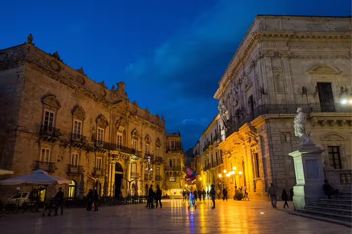 Piazza Duomo Ortigia at dusk with baroque palaces, scene from Syracuse scavenger hunt self-guided tour