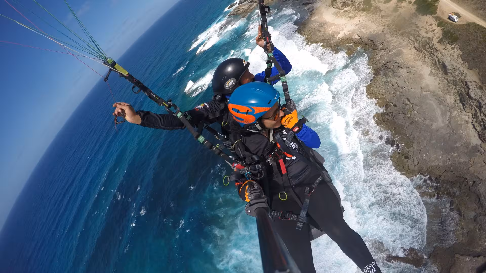 Experience thrilling tandem paragliding over Littigheddu's scenic coastline in Castelsardo, with stunning ocean views.