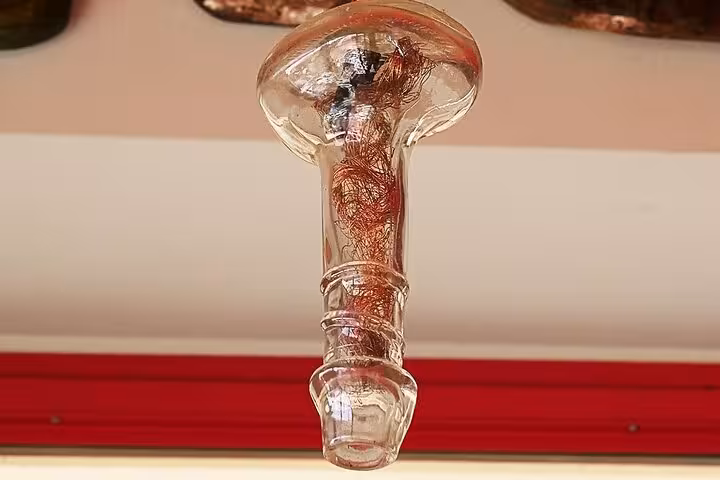 Unique glass artwork displayed in a Taormina artisan shop, showcasing Sicilian craftsmanship.