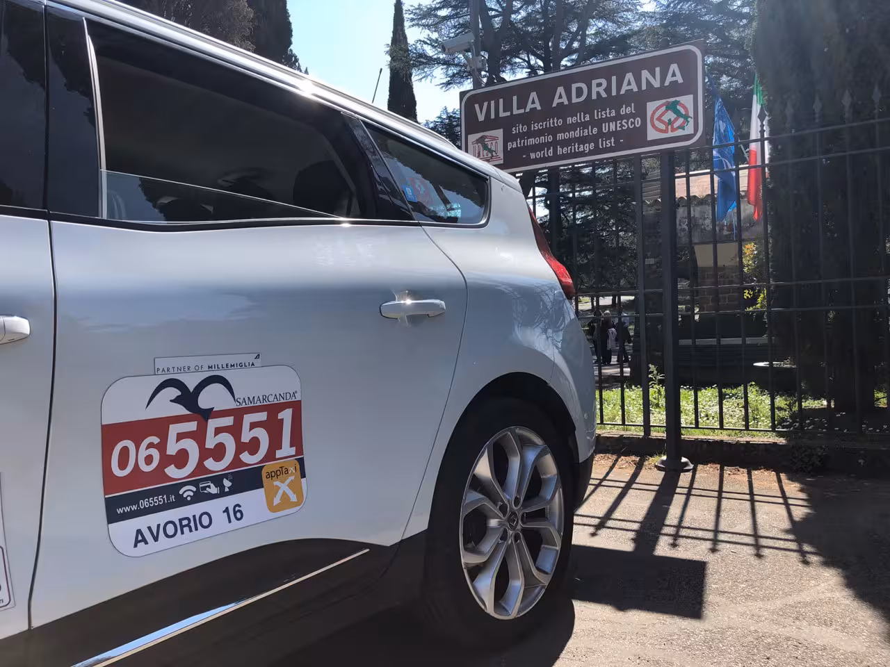 Taxi parked near Villa Adriana entrance in Tivoli, ideal for a convenient day trip to this UNESCO World Heritage site.