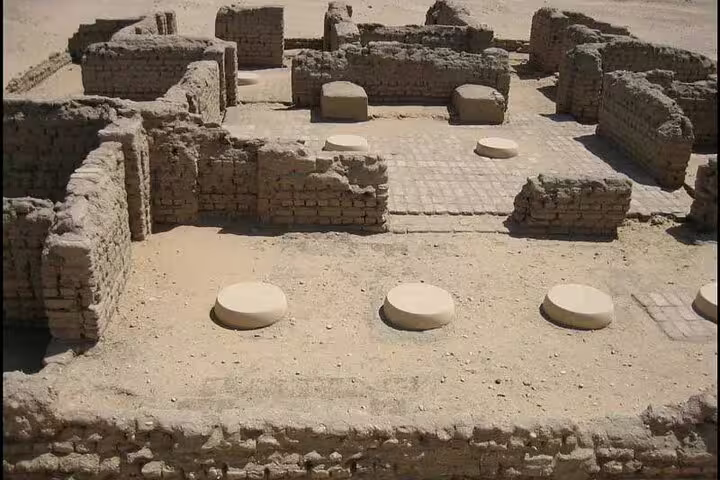 Mudbrick ruins and excavated courtyard at Tell el-Amarna, El Minya day trip from Cairo by private car
