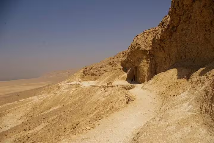 Desert trail to rock-cut tomb entrance at Tell el-Amarna, a highlight of an unusual private day tour in Egypt