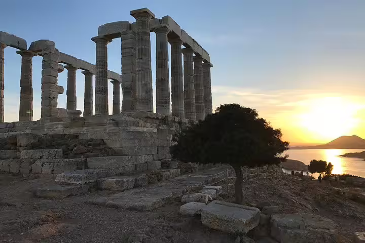 Temple of Poseidon ruins at Cape Sounion during golden hour, scenic Athens half-day small-group tour stop