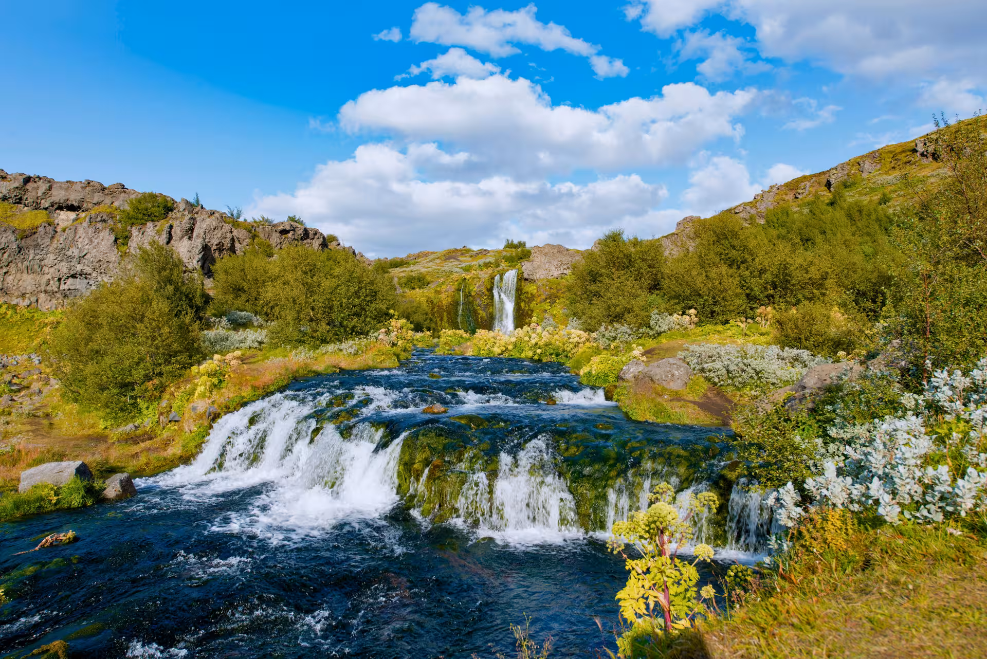 Gljúfurleitarfoss waterfall and lush river cascades in Þjórsárdalur Valley on a private Iceland tour