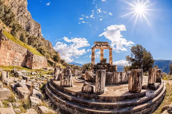Tholos of Athena Pronaia in Delphi under bright sun, highlight stop on 2-day Delphi and Meteora private trip
