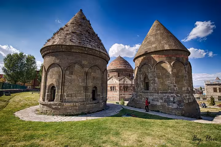 Three Domes (Üç Kümbetler) in Erzurum on a private guided city tour, Seljuk tombs under blue sky