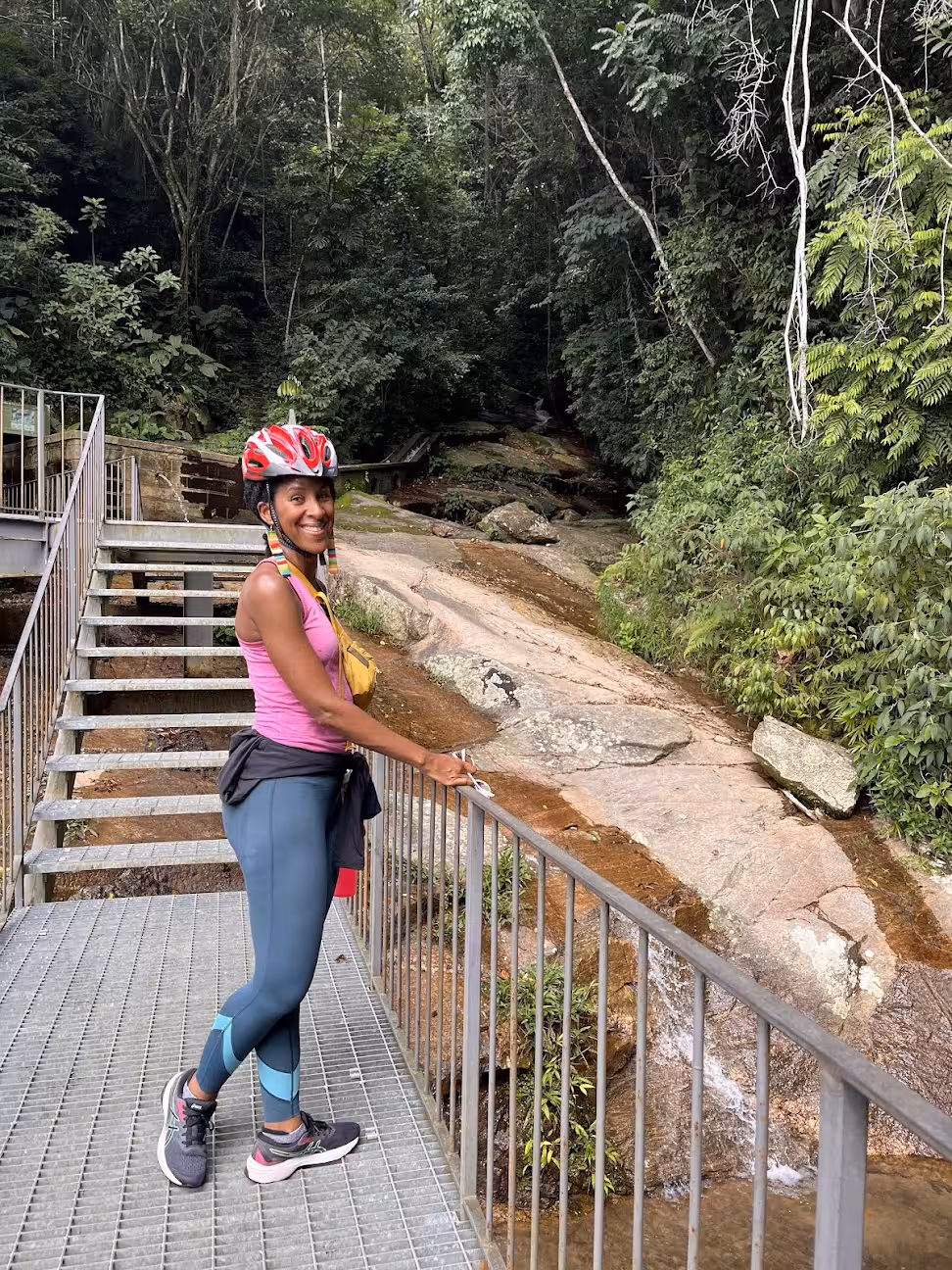Mountain bike tour stop at a rainforest waterfall walkway in Tijuca Forest, Rio de Janeiro eco adventure
