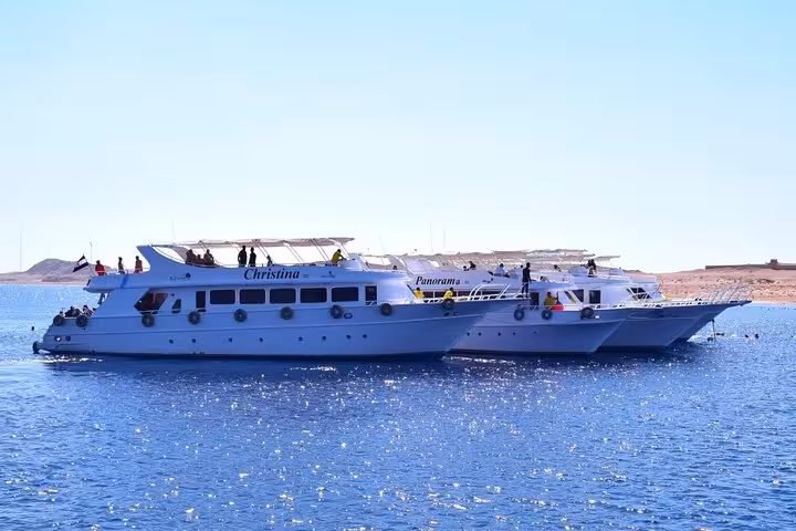 Two tour boats cruising to Tiran Island from Sharm El Sheikh across the Red Sea for a full-day snorkeling trip