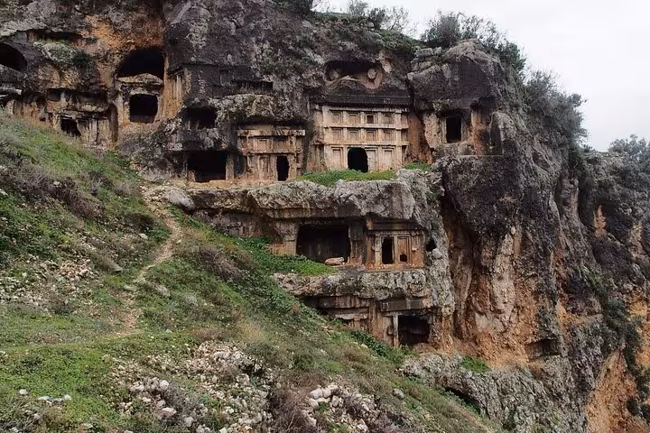 Ancient rock tombs nestled in the rugged cliffs of Tlos, a highlight of the Saklıkent Canyon tour from Fethiye.