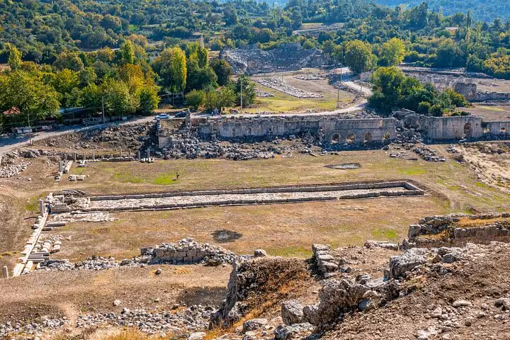 Explore the ancient ruins of Tlos surrounded by lush greenery on a guided tour from Fethiye.