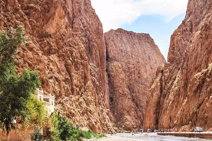 Dramatic rock formations of Todra Gorge with a narrow path, capturing a stunning natural wonder in Morocco.