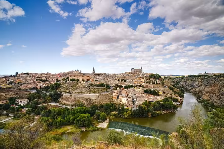 Scenic view of Toledo's historic landscape and Tagus River, a key destination on the Andalusia tour from Madrid.