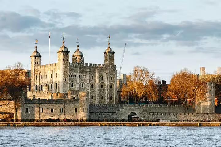 Historic Tower of London by the River Thames, showcasing medieval architecture and a key highlight of the private London tour.