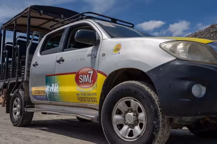 Toyota Hilux 4x4 with open-air seats for Jericoacoara to Fortaleza transfer, Ceará coast transport