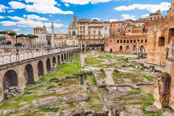 Panoramic view of Trajan’s Markets and Imperial Forum ruins in Rome on a sunny day during a skip-the-line private tour