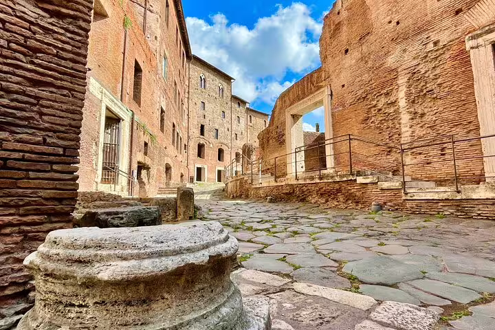 Ancient stone pathway and arches inside Trajan Markets in Rome, explored on an exclusive Imperial Forum skip-the-line tour