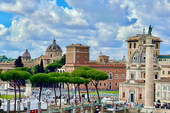 Historic churches, Trajan’s Column and lively piazza near Trajan’s Markets in Rome seen on a skip-the-line Imperial Forum tour