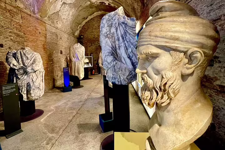 Ancient Roman busts and marble statues displayed inside Trajan’s Markets museum on an Imperial Forum skip-the-line private tour
