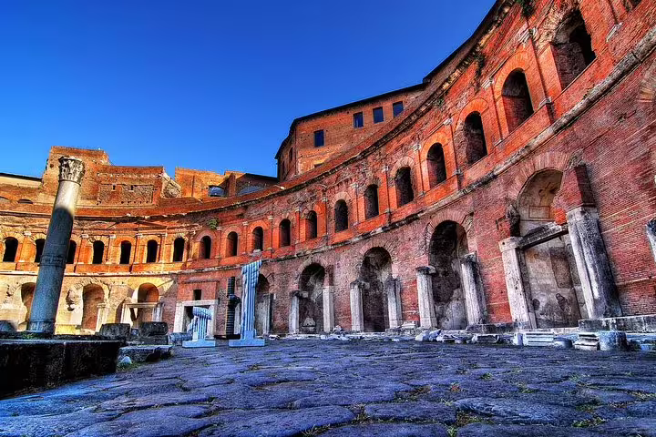 Panoramic view of Trajan’s Markets in Rome with ancient arches and columns on a sunny skip-the-line private tour