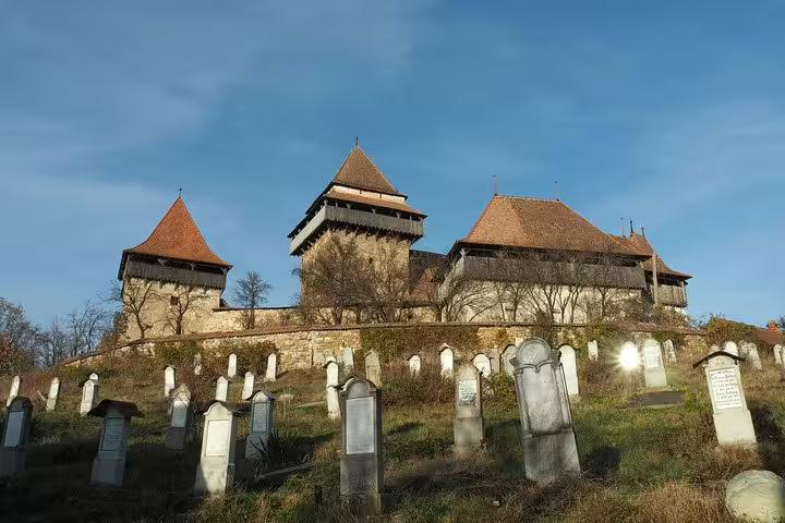Medieval fortified church with towers and cemetery in Transylvania, Romania